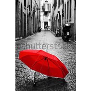 Red Umbrella on cobblestone