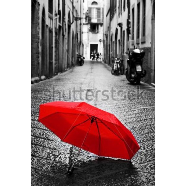 Red Umbrella on cobblestone